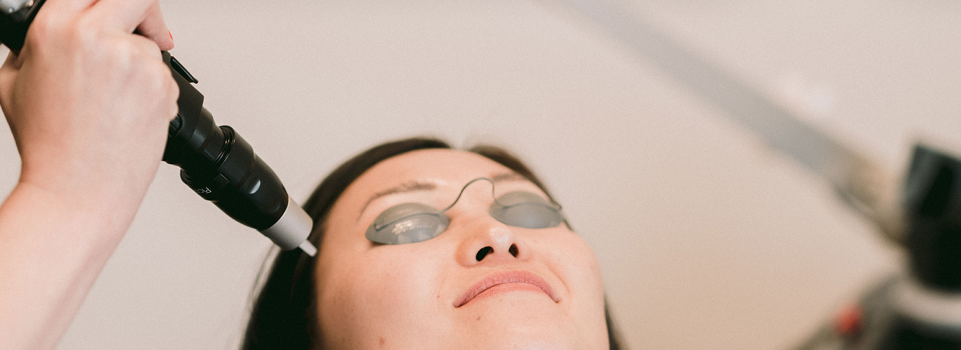 A woman is having a laser skin treatment.